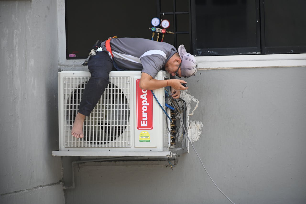 professional doing an ac tune up in highland village texas